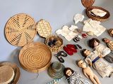 a lot of dolls and other items on the floor