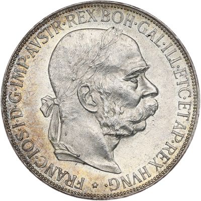 a close up of a coin with a man ' s face on it