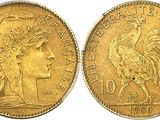 a gold coin with an image of a woman and a rooster on it