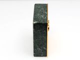 green marble box with gold trim on a white background