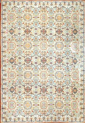 a rug with an orange border and a floral design on it