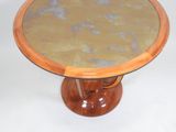 a small table with a glass top on a white surface