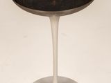a white table with a metal tray on it