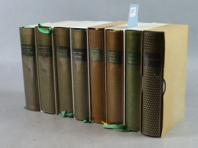 several books are stacked on top of each other on a table
