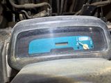 a close up of a car dashboard with a number plate on it