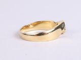 an image of a gold ring with a green stone