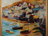 un tableau représentant des bateaux sur le rivage d'une ville