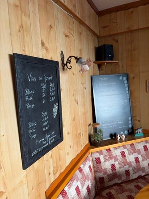 a couch and a table in a room with wood paneled walls