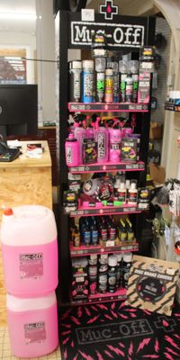 a shelf with a lot of paint on it in a store
