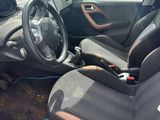 a picture of a car that has been left in the dirt