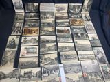 a lot of old postcards that are on the table
