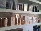 many different types of skin care products displayed on the shelves