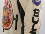a mannequin wearing a jacket with patches on it
