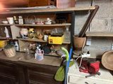 a kitchen with a lot of clutter on the counter