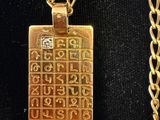 gold plated necklace with a gold chain and a gold pendant with a gold chain and a gold plated necklace with a gold chain and a gold chain with a