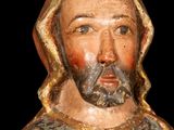 a statue of a man with a beard and wearing a robe