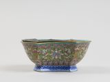 a close up of a bowl on a table with a white background
