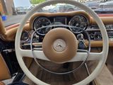 dashboard of a car with a steering wheel and dashboard controls