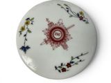a white plate with a red and blue design on it