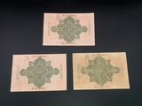 three different pieces of paper with a cross design on them