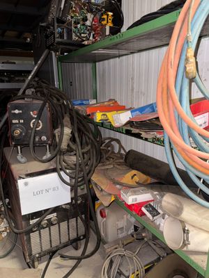 a lot of wires and other items on the shelves