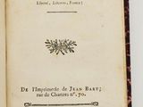 an open book on a white surface with a black border