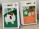 two bags that have pictures of dogs on them