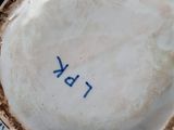 a close up of a plate with a blue and white design on it