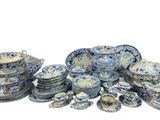 a lot of blue and white china dishes and cups