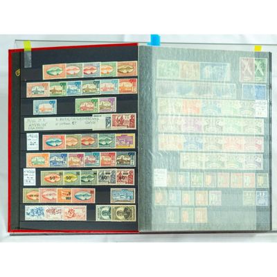 an open book with stamps on it on a table