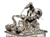 a statue of a man riding a horse on top of a box