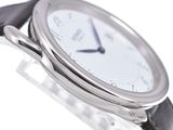 a close up of a wrist watch with a white dial