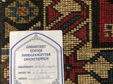 an image of a label on a rug with a picture of a cat