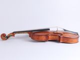 a close up of a violin with a bow on a white background
