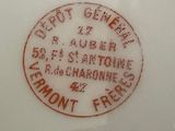 a close up of a plate with a stamp on it