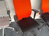 three chairs that are sitting next to each other in a room