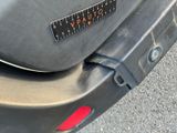 a close up of a car ' s rear bumper with a sticker on it