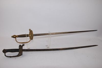 une vieille épée avec un manche en bois sur une surface blanche