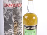 a bottle of chartreuse whisky next to a box