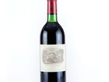 a bottle of wine that is sitting on a table