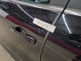 a car door handle with a sticker on it