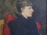 portrait of a woman in a black dress sitting in a chair