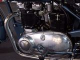 a blue motorcycle that is parked in a garage