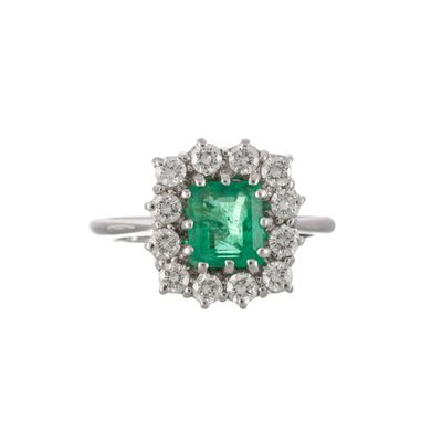 an emerald and diamond cluster ring