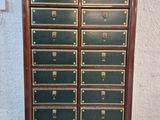 an image of a wooden cabinet with many drawers on it