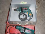 a box with a drill and a cord in it