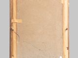 an old picture of a wooden frame with a piece of paper on it