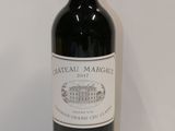 a bottle of wine that is sitting on a table