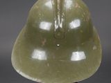 helmet on a black stand with a gray background