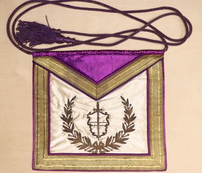 an image of a purple and gold cross on a purple and gold bag